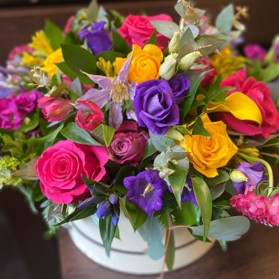 Simply The Best - A beautiful hat-box filled with a vibrant collection of flowers and foliage.