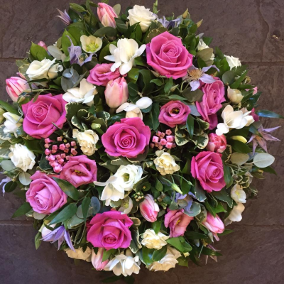 Posy SYM-346 - A lovely red and pink classic funeral posy handmade to order by our funeral tribute specialists and delivered by hand.