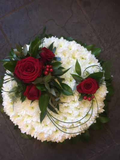 Posy SYM-344 - A delightful funeral posy featuring a white massed base and a red rose spray, handmade by our in-house florists using market fresh flowers.
